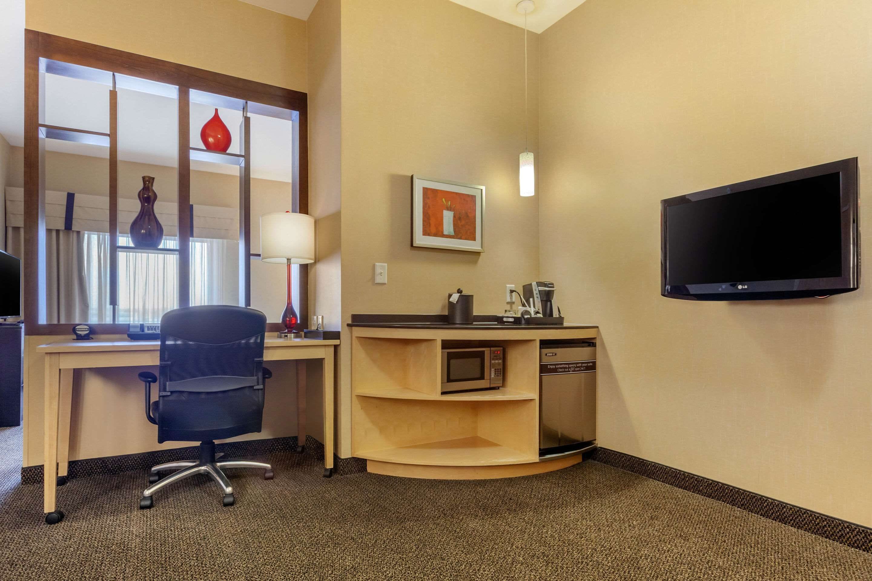 premium bedding, desk, blackout curtains, iron/ironing board