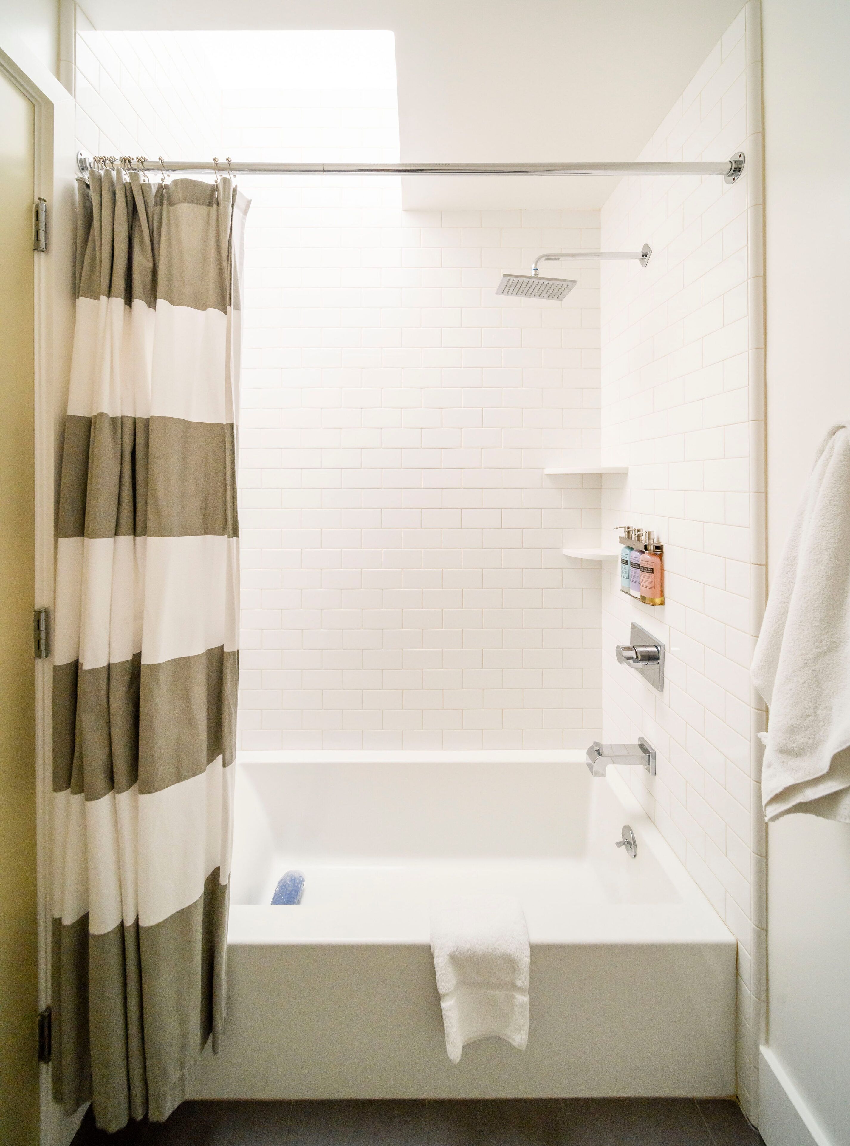deluxe room, 1 king bed | bathroom | rainfall showerhead, free toiletries, hair dryer, towels
