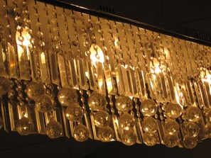 A chandelier with multiple crystal elements and light fixtures. - The Miami Sun Hotel (Miami)