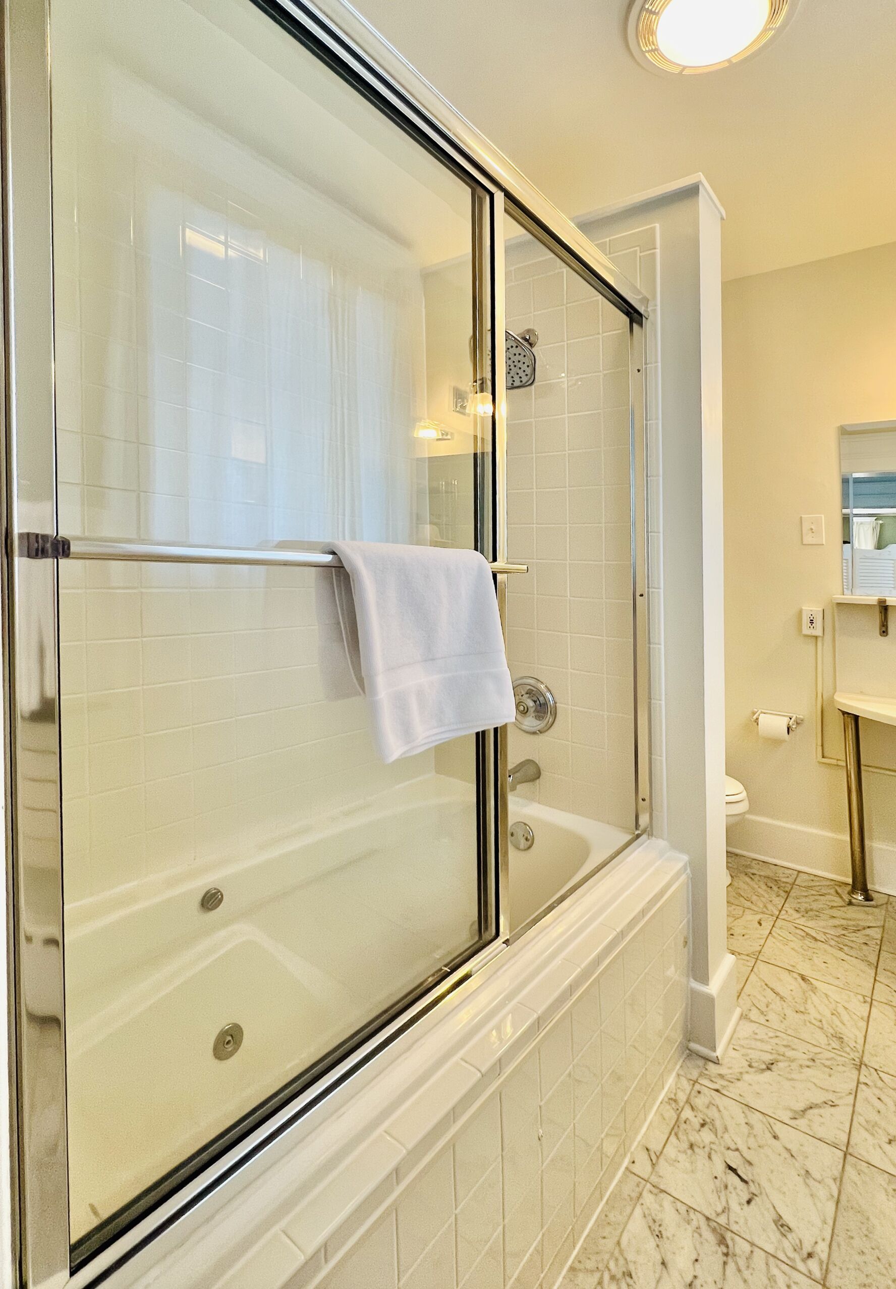 luxury suite | bathroom | rainfall showerhead, hair dryer, bathrobes, slippers