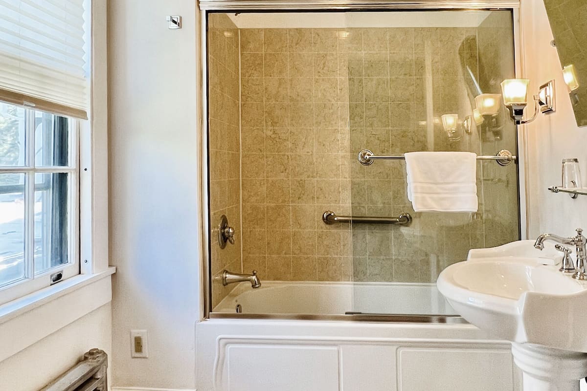 rainfall showerhead, hair dryer, bathrobes, slippers