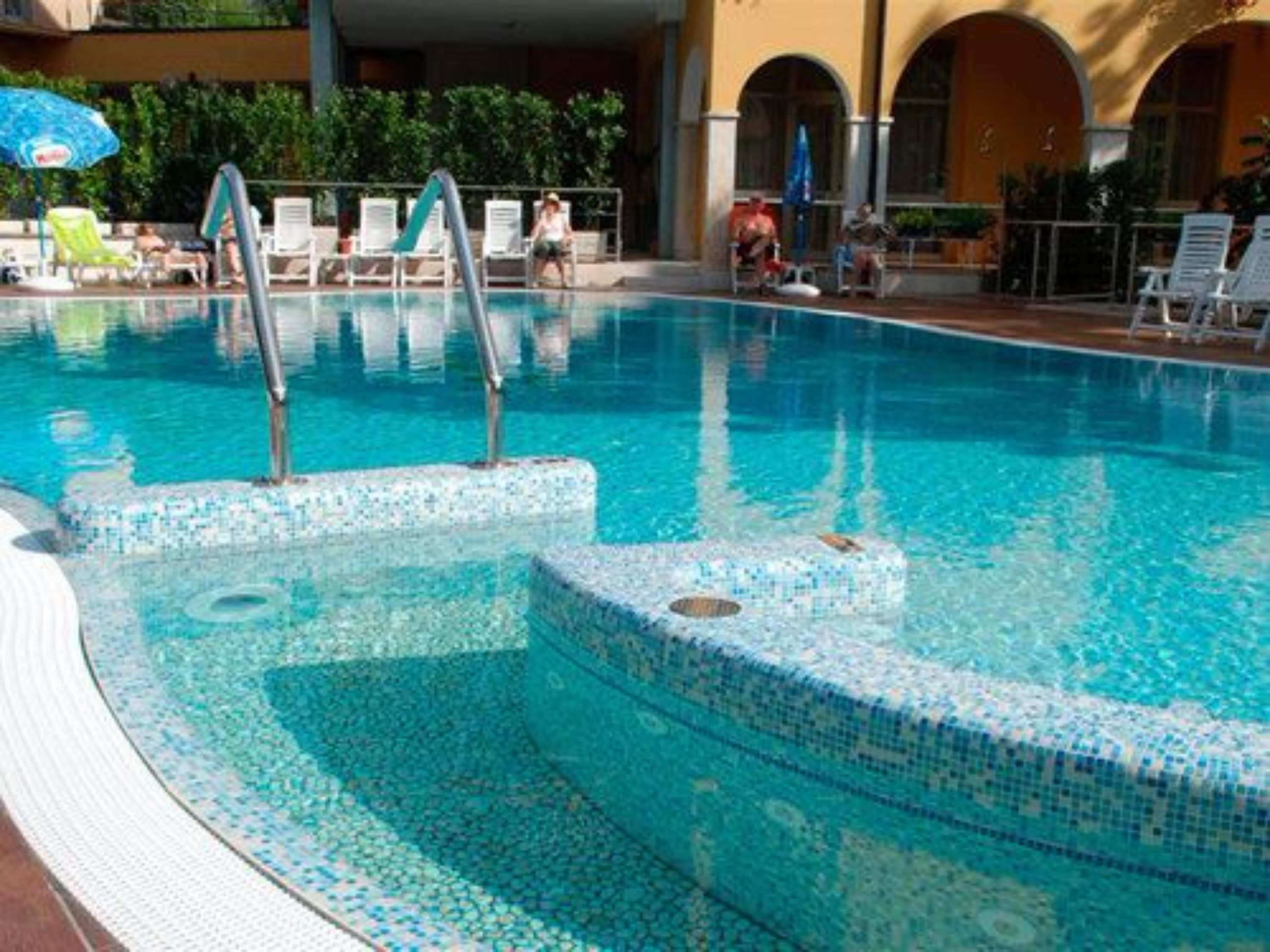 Seasonal outdoor pool, open 8:00 AM to 7:00 PM, pool umbrellas