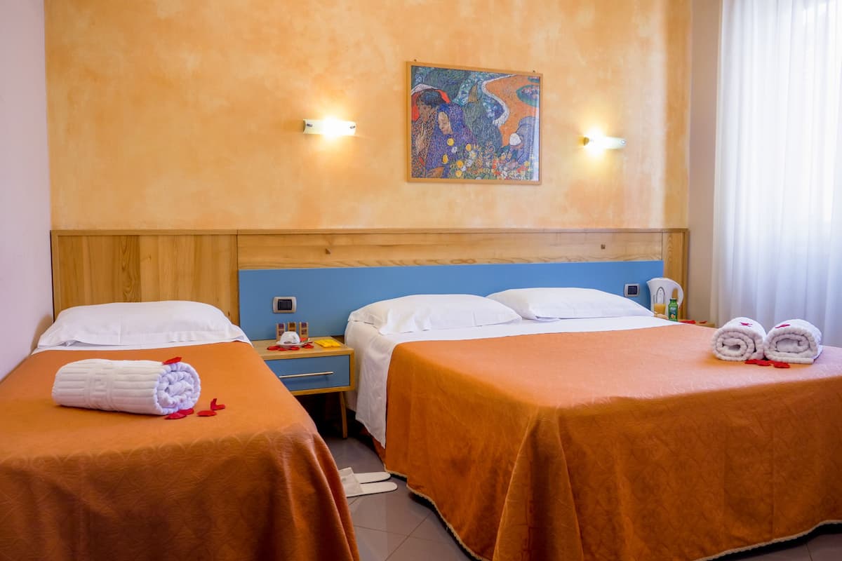 triple room | premium bedding, in-room safe, individually decorated, desk