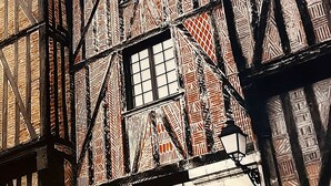 A row of traditional half-timbered buildings with exposed wooden beams and brickwork. - Hotel Mondial (Tours)