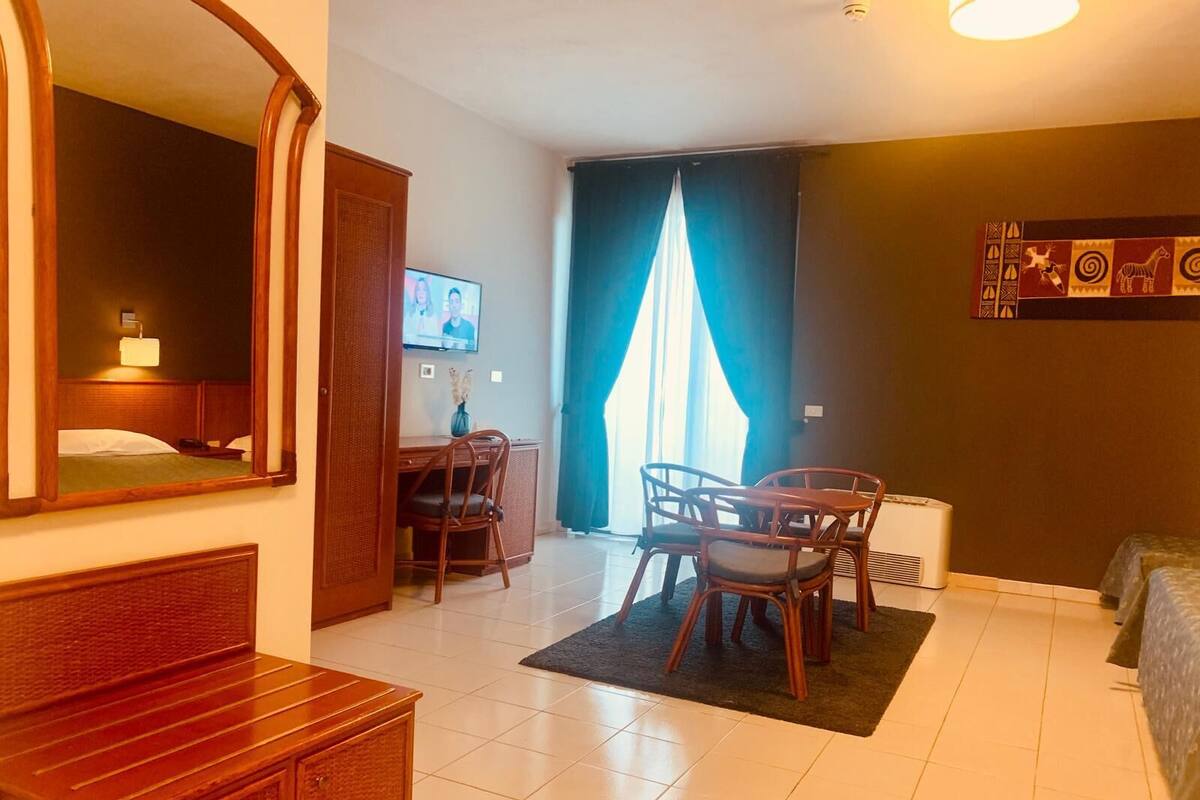 Deluxe Studio Suite, Private Bathroom, Poolside | Down duvets, minibar, in-room safe, desk