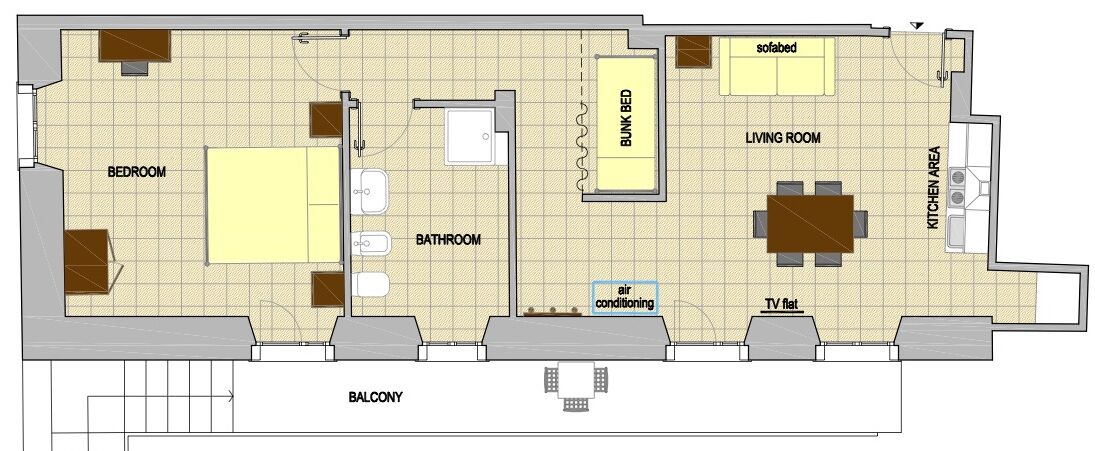 Un plan d’étage d’une chambre d’hôtel comprenant une chambre à coucher, une salle de bain, un salon et un coin cuisine.