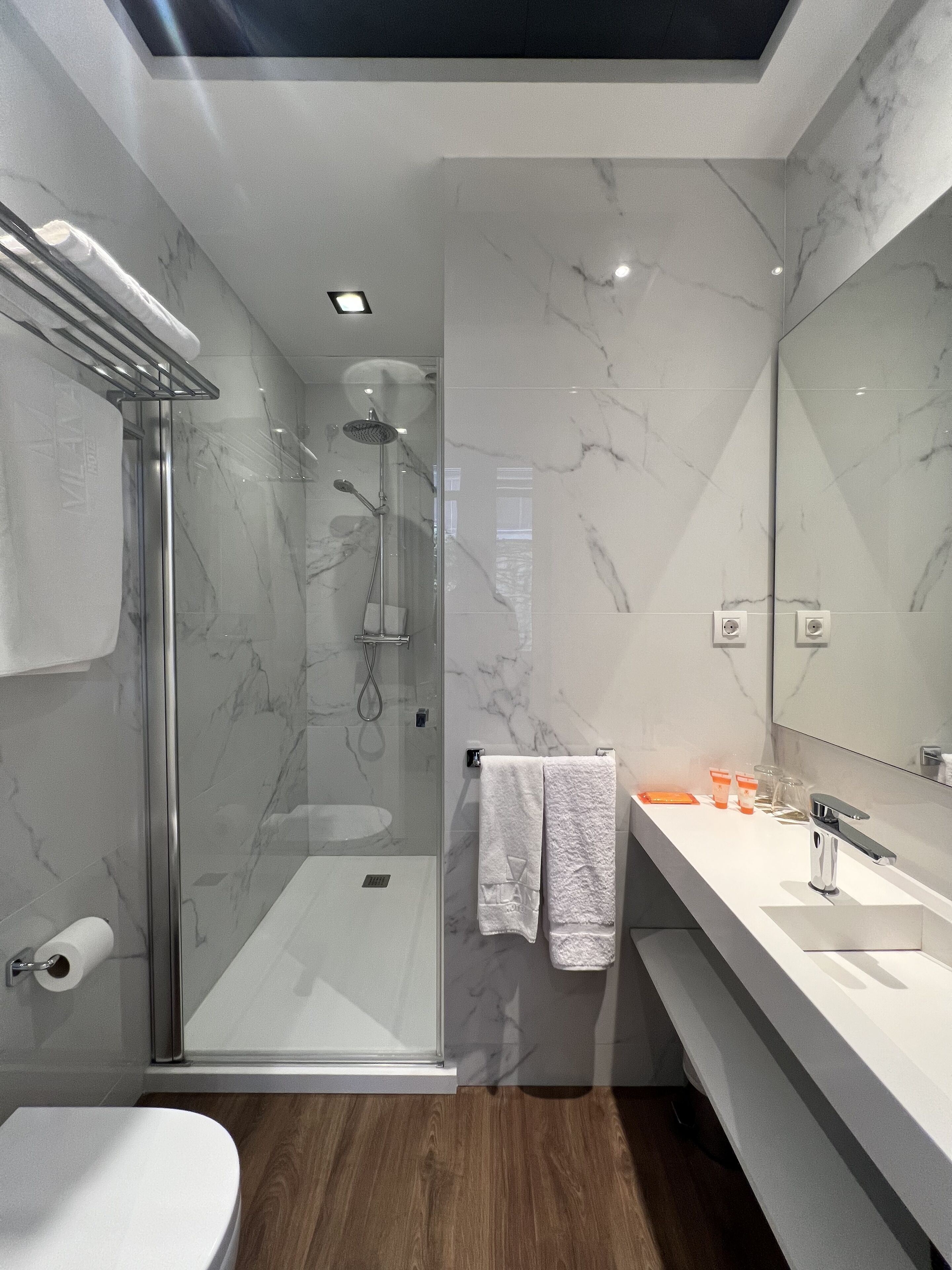 economy single room | bathroom | shower, hair dryer, towels, soap