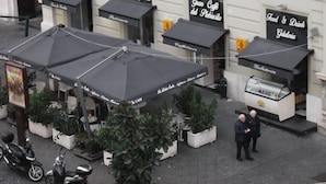 Outdoor seating with umbrellas, a gelateria, and a food & drink stand. - B&B Santa Lucia 50 (Naples)