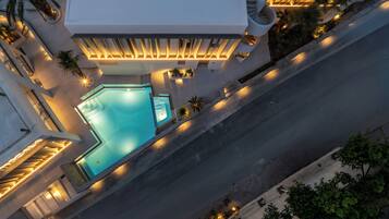 Seasonal outdoor pool, open 10:00 AM to 6:00 PM, pool loungers