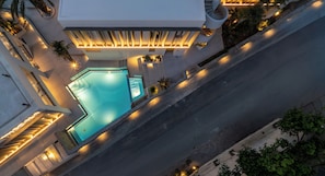Seasonal outdoor pool, open 10:00 AM to 6:00 PM, sun loungers