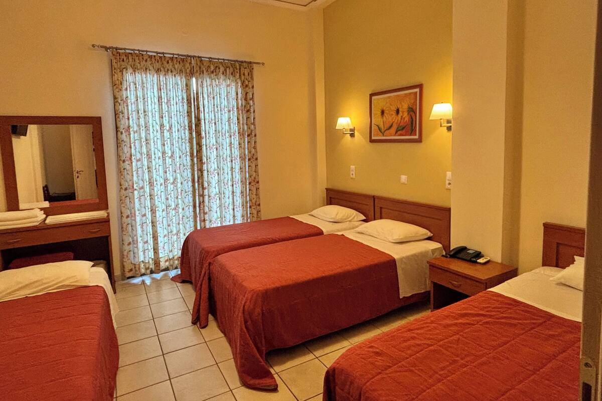 Quadruple Room | Pillowtop beds, in-room safe, desk, laptop workspace