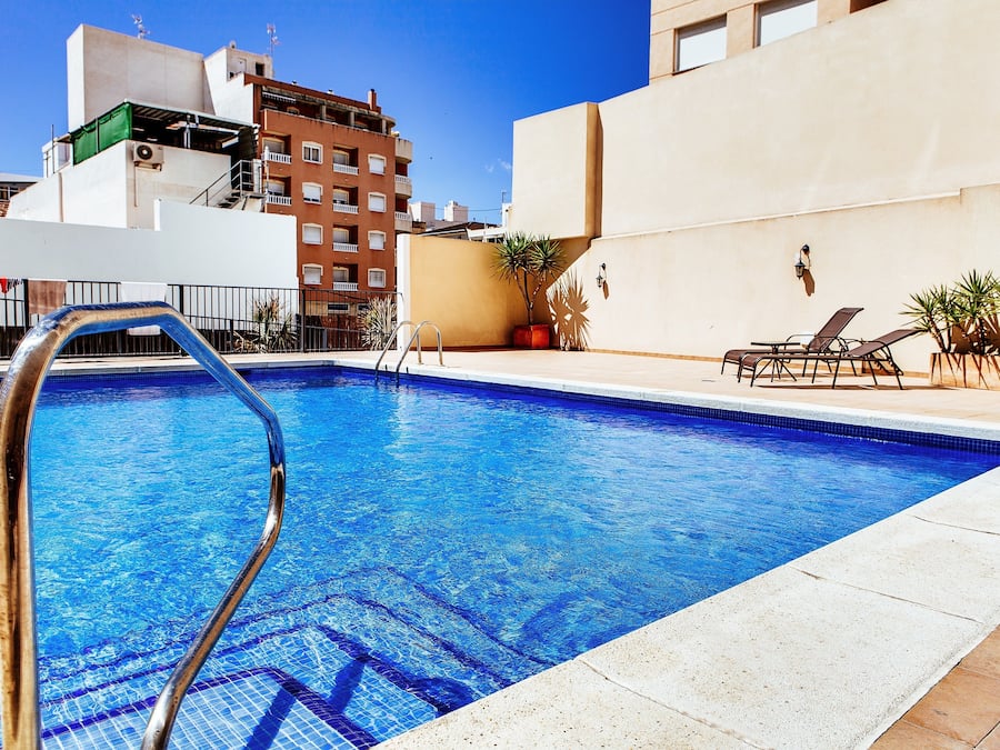 Outdoor pool, open 9 AM to 9 PM, pool umbrellas, pool loungers