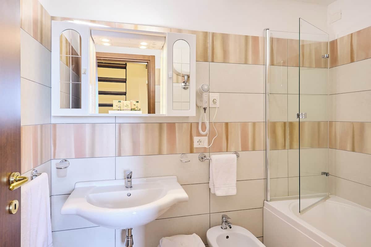 classic double or twin room | bathroom | shower, free toiletries, hair dryer, slippers