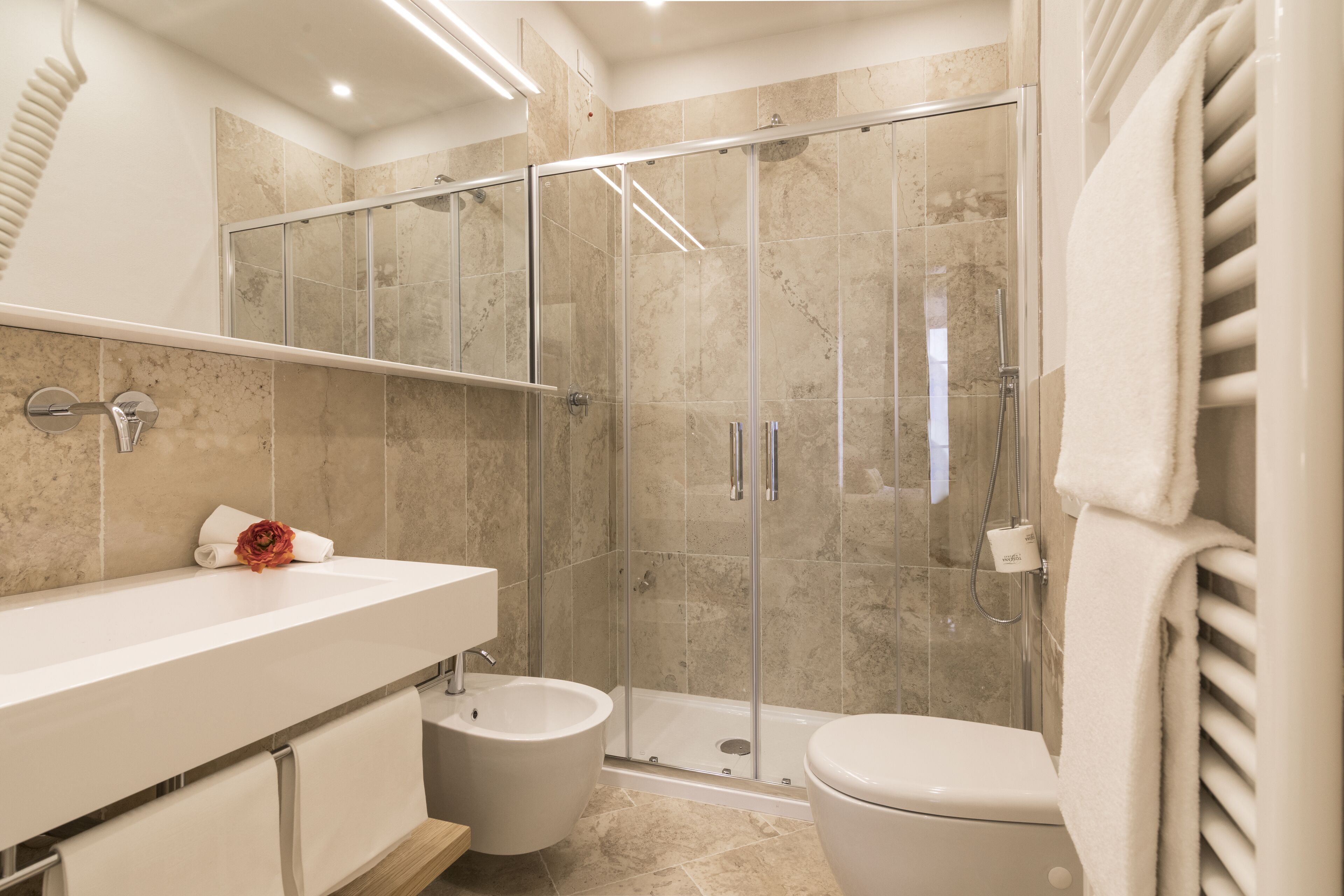 rainfall showerhead, hair dryer, bidet, towels