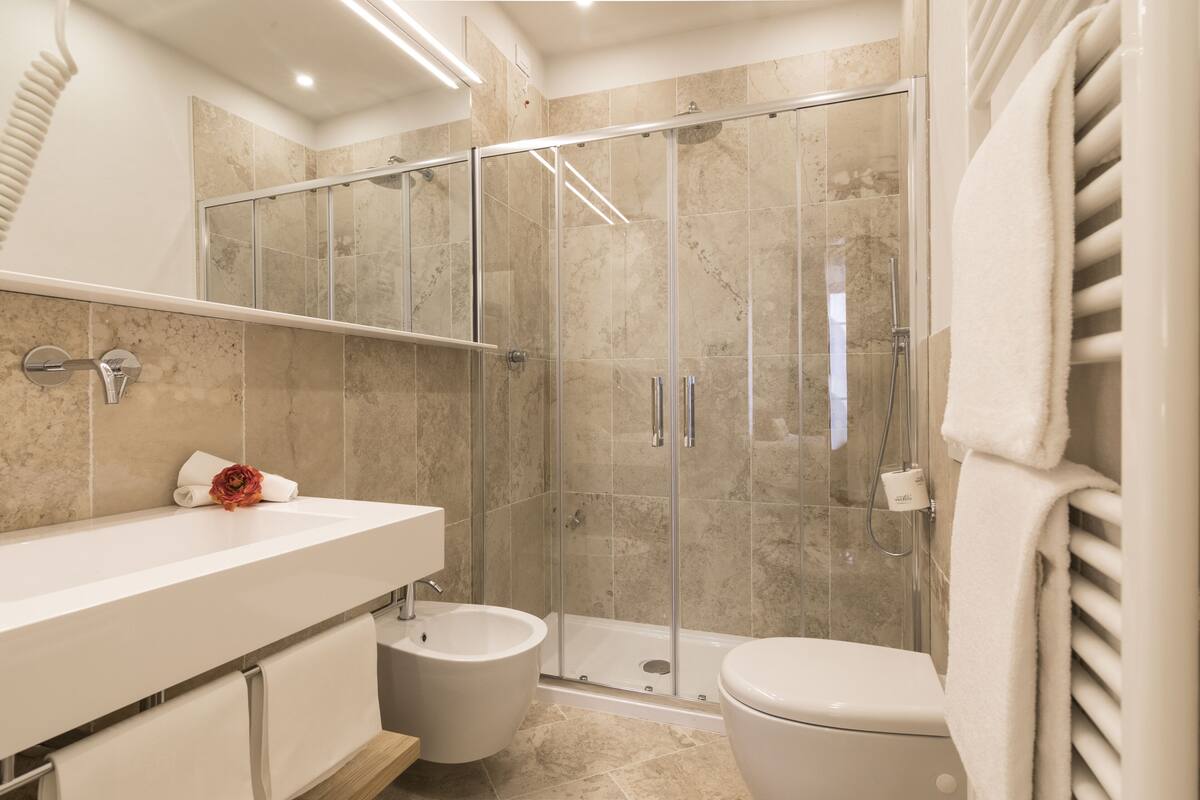 rainfall showerhead, hair dryer, bidet, towels