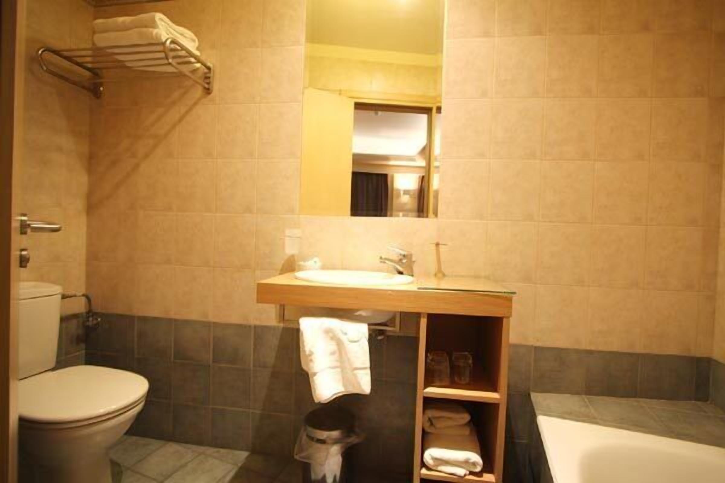 combined shower/bathtub, rainfall showerhead, designer toiletries