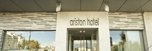 The exterior of the ariston hotel with a modern facade and large windows. - Ariston (Athens)