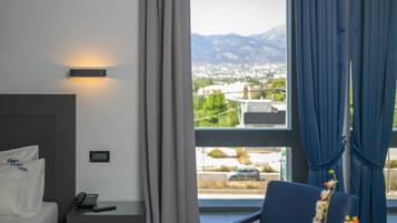 Deluxe Double Room, Balcony | Living area | 32-inch flat-screen TV with satellite channels, TV