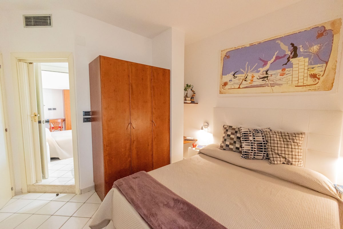 Superior Quadruple Room | Minibar, in-room safe, desk, iron/ironing board