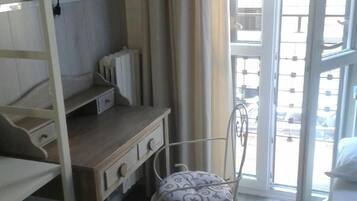Desk, laptop workspace, blackout curtains, free WiFi