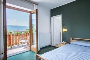 Habitación doble | Caja de seguridad en la habitación, escritorio, cunas y camas extra 