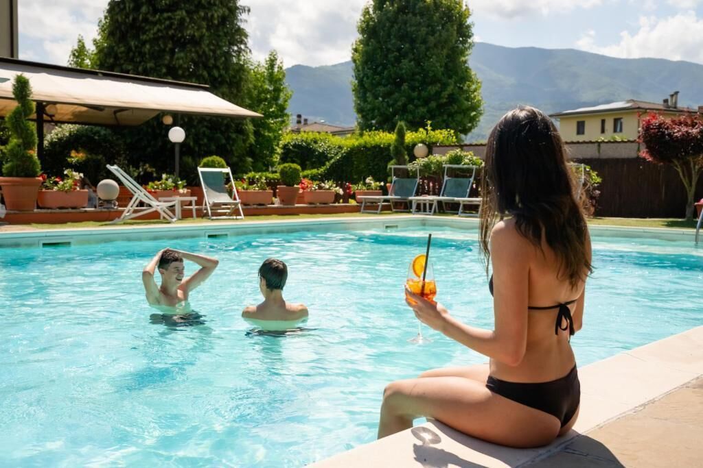 Seasonal outdoor pool, pool umbrellas, pool loungers