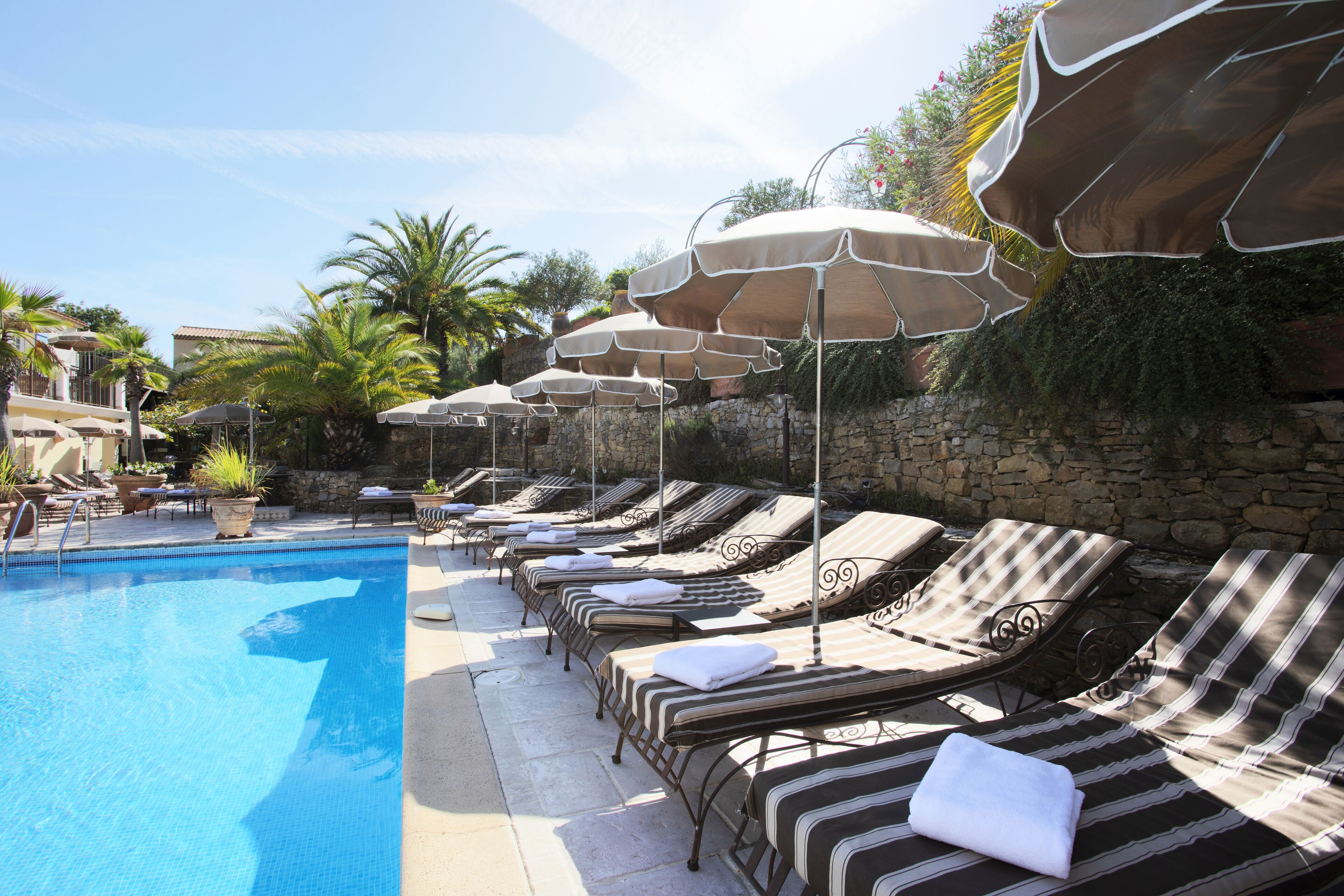 outdoor pool, pool umbrellas, pool loungers