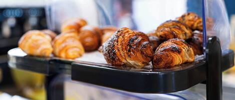 A bakery display case with croissants.