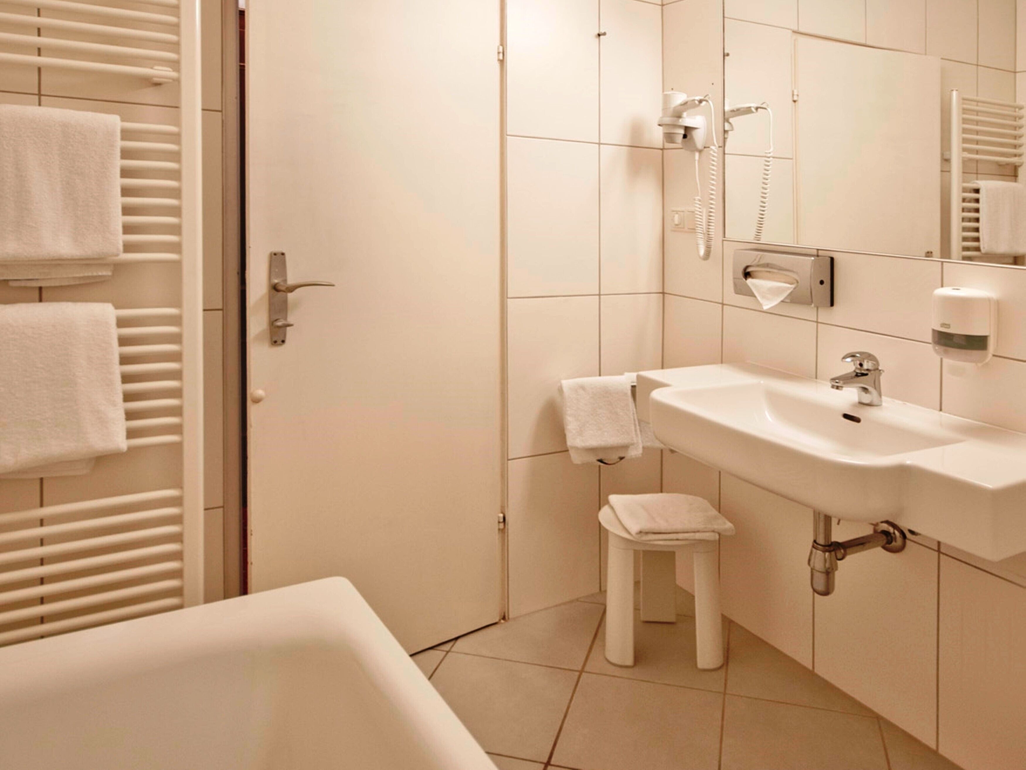 deep-soaking bathtub, free toiletries, hair dryer, slippers