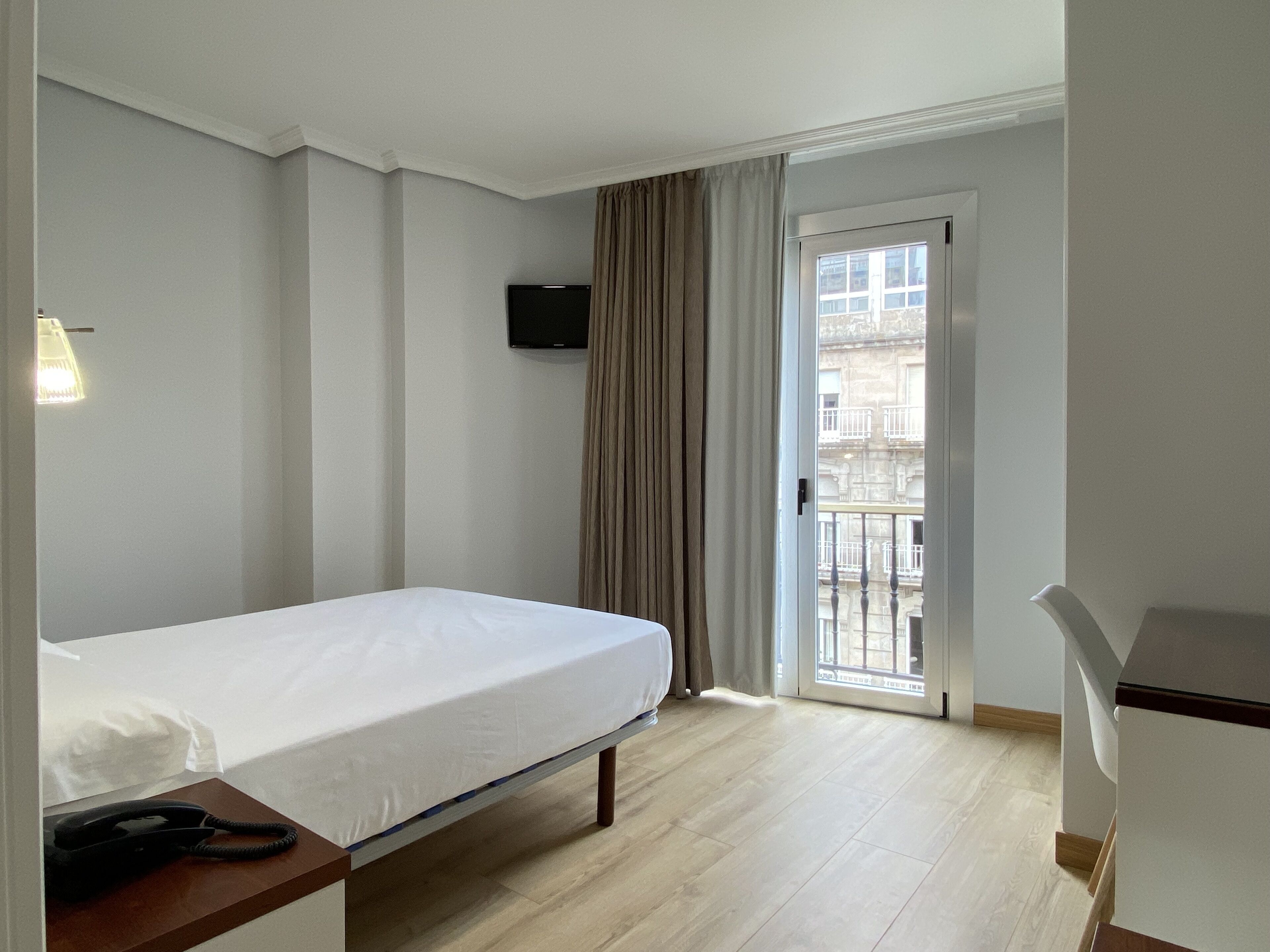 Desk, laptop workspace, blackout curtains, free WiFi