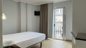 Desk, laptop workspace, blackout curtains, free WiFi