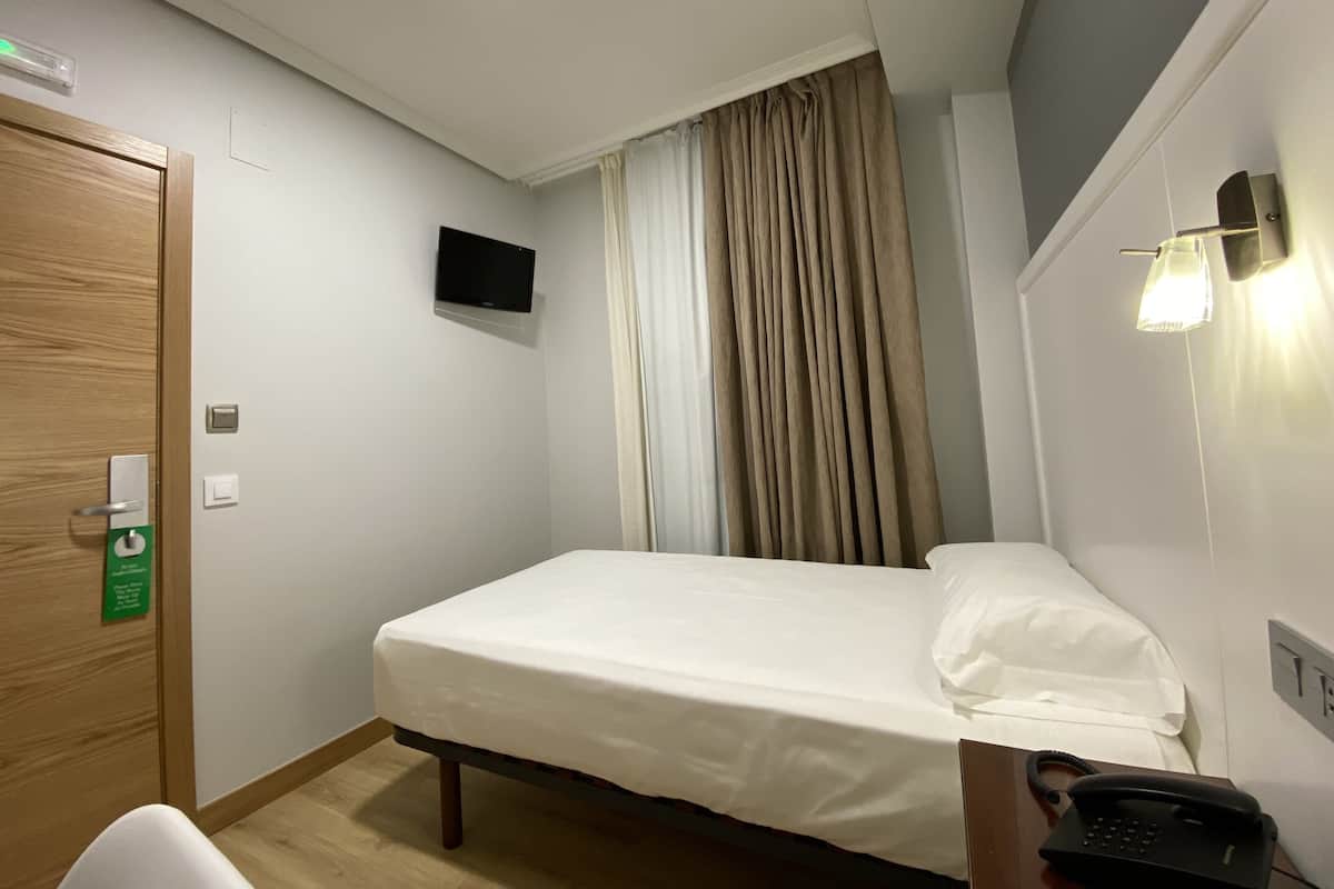 Desk, laptop workspace, blackout curtains, free WiFi