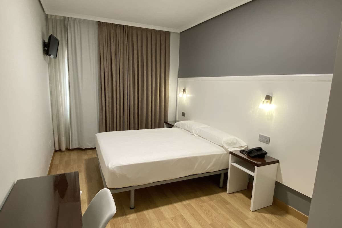 Desk, laptop workspace, blackout curtains, free WiFi