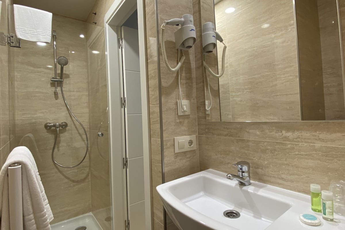economy single room | bathroom | rainfall showerhead, free toiletries, hair dryer, bidet