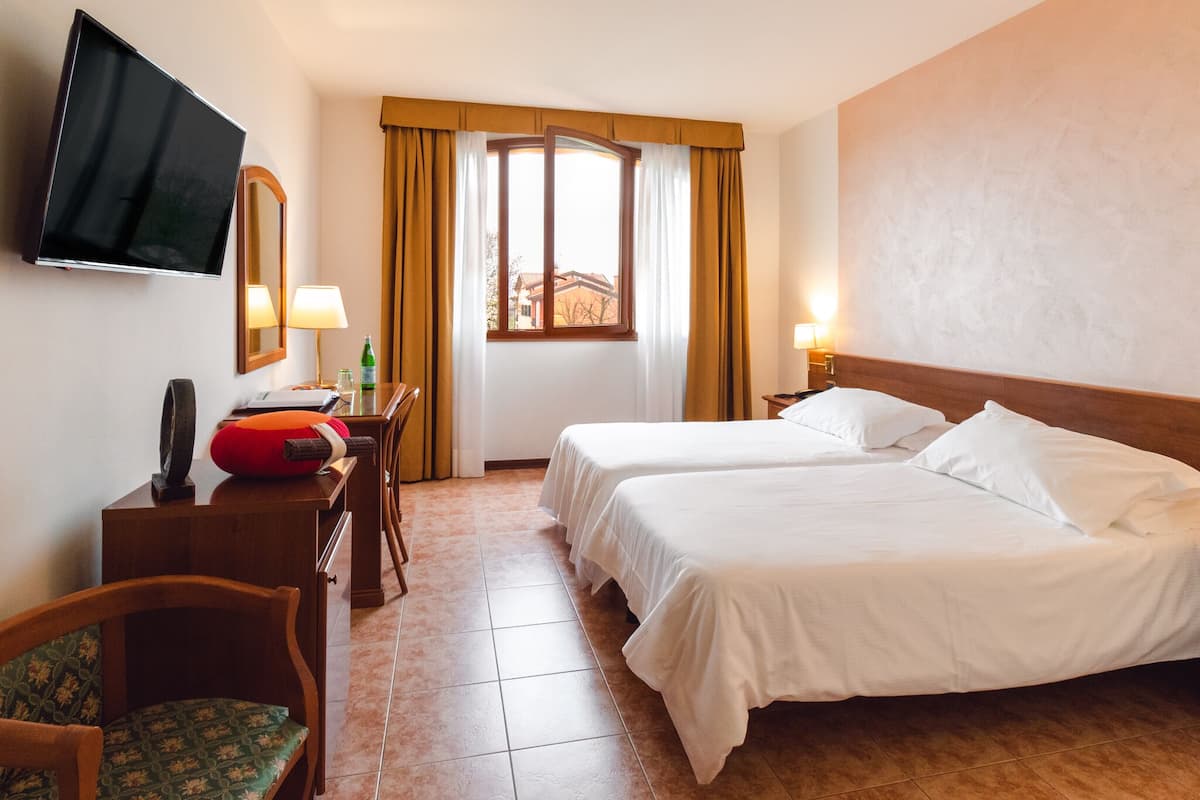 Premium bedding, down duvets, in-room safe, desk