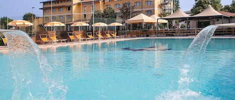 Indoor pool, seasonal outdoor pool, pool umbrellas, pool loungers