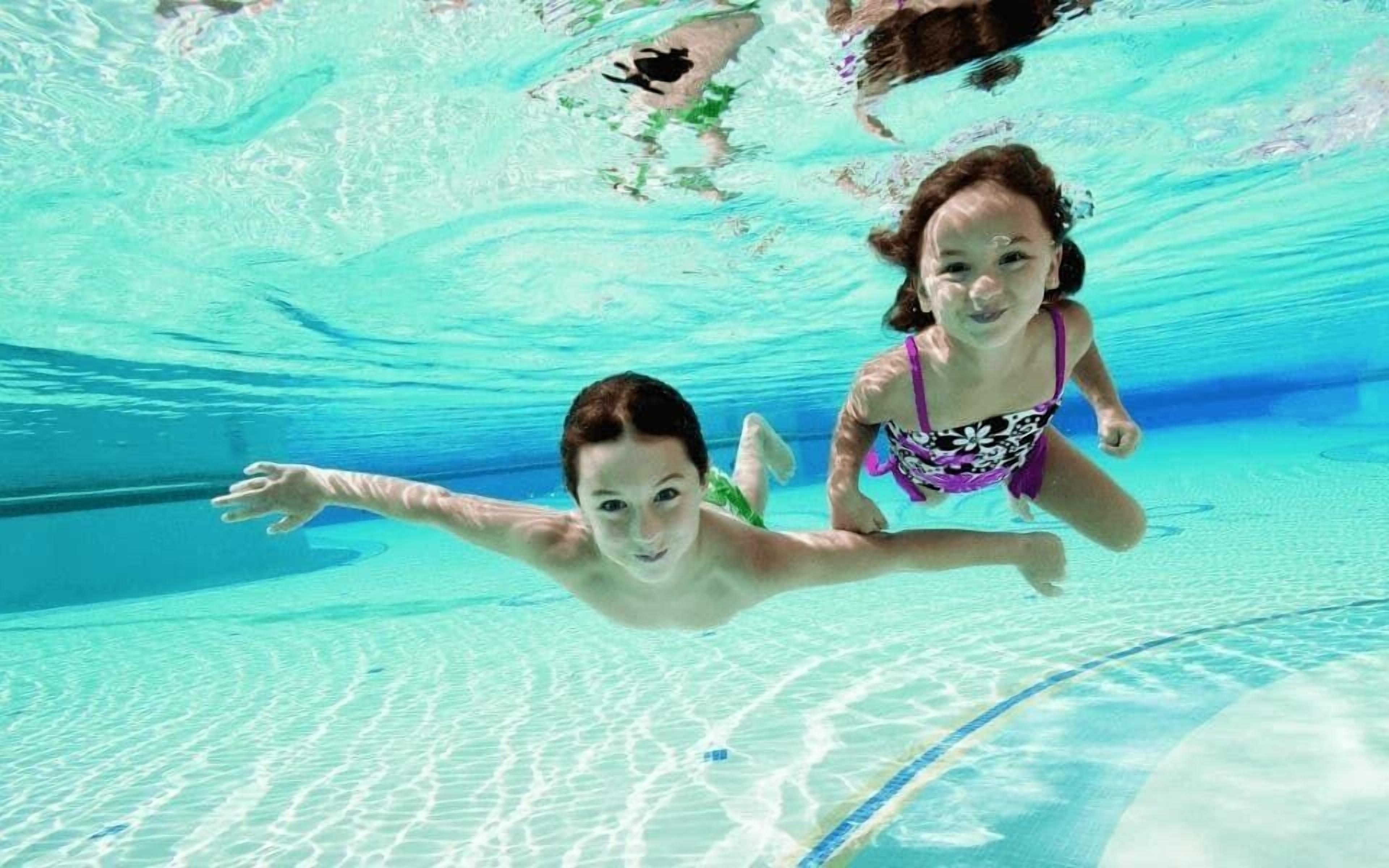 Seasonal outdoor pool, open 10:30 AM to 6:00 PM, pool umbrellas