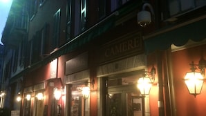 A building with a sign reading "CAMERE" indicating a hotel or lodging establishment. - In Riva al Lago (Como)