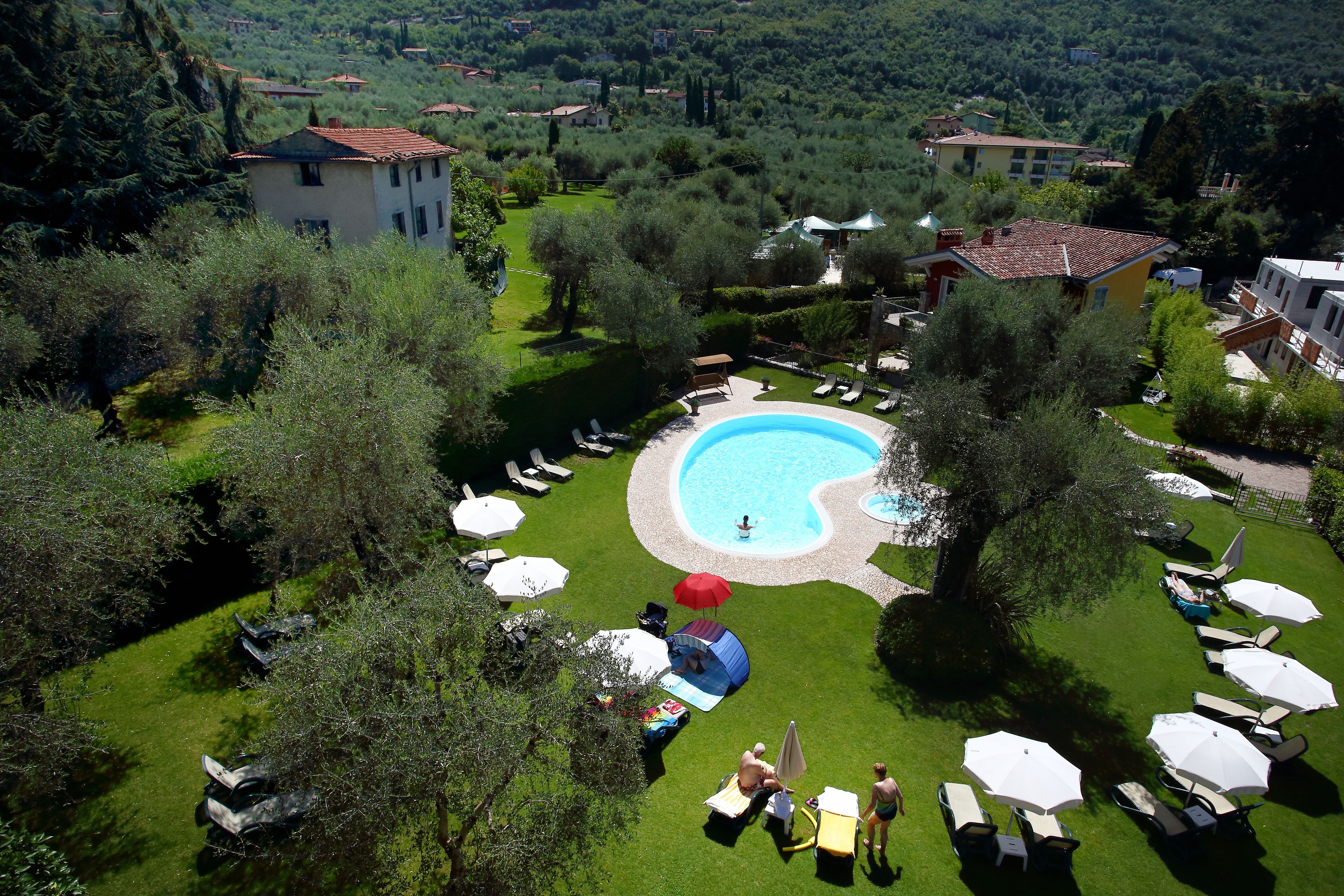 outdoor pool, open 8 am to 7 pm, pool umbrellas, pool loungers