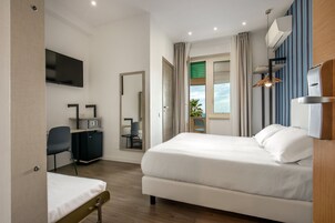 Triple Room, Sea View | Memory foam beds, in-room safe, desk, iron/ironing board