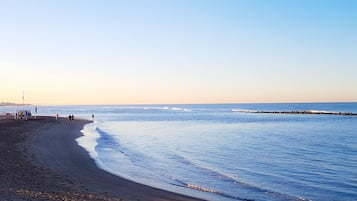 Beach nearby, black sand, beach towels