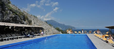 Outdoor pool, open 8:00 AM to 6:30 PM, pool umbrellas, pool loungers