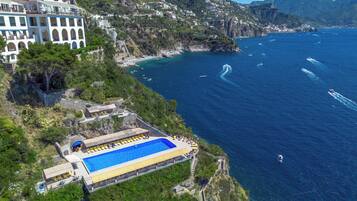 Outdoor pool, open 8:00 AM to 6:30 PM, pool umbrellas, pool loungers