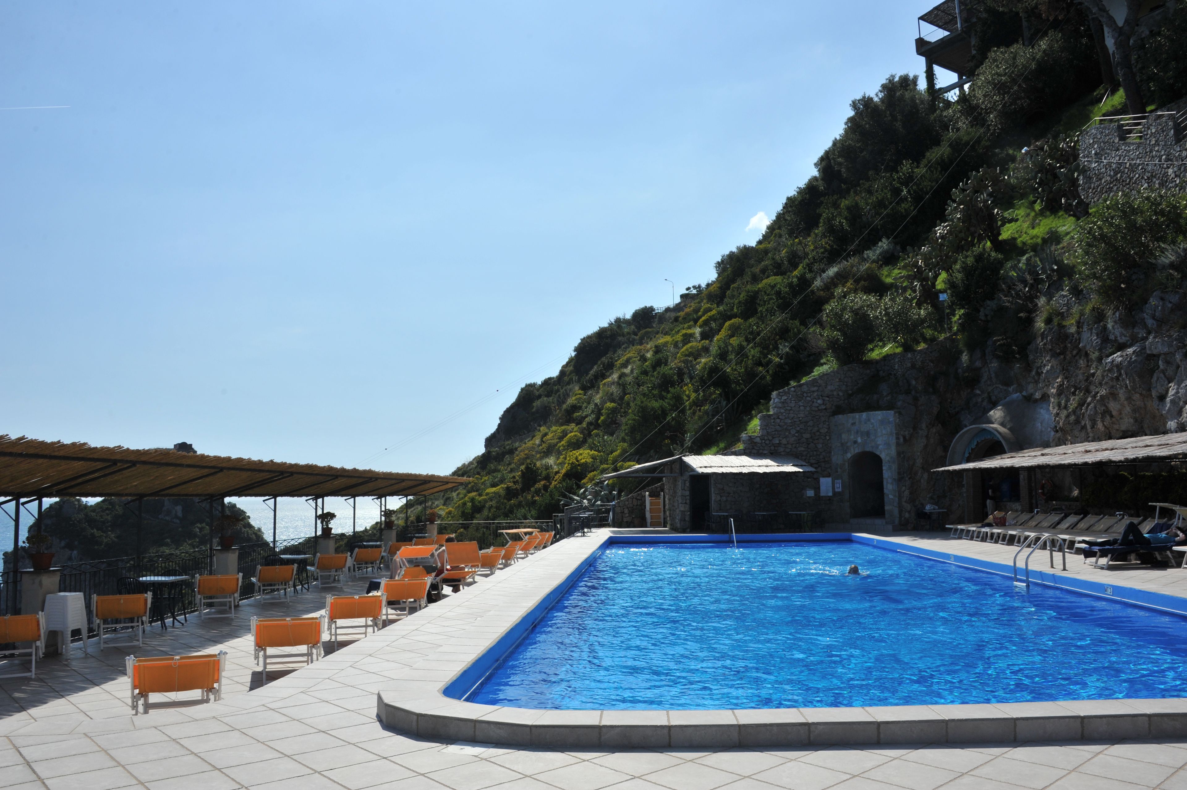 outdoor pool, open 8:00 am to 6:30 pm, pool umbrellas, pool loungers