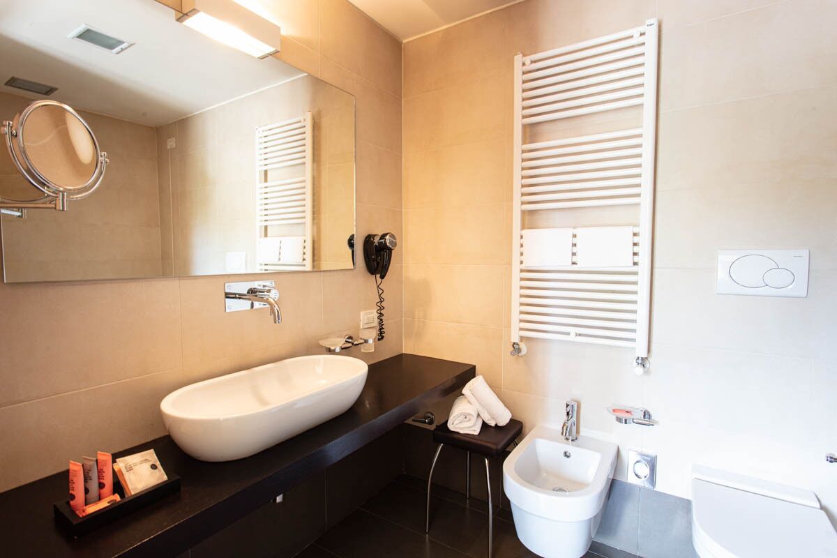 eco-friendly toiletries, hair dryer, bidet, towels