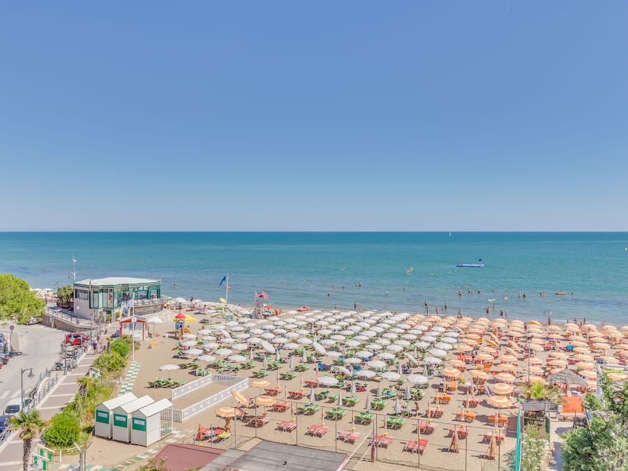 On the beach, sun-loungers, beach towels, beach yoga