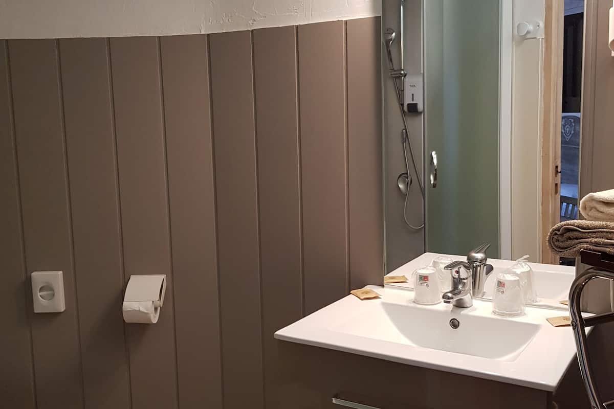comfort room | bathroom | shower, rainfall showerhead, hair dryer, towels