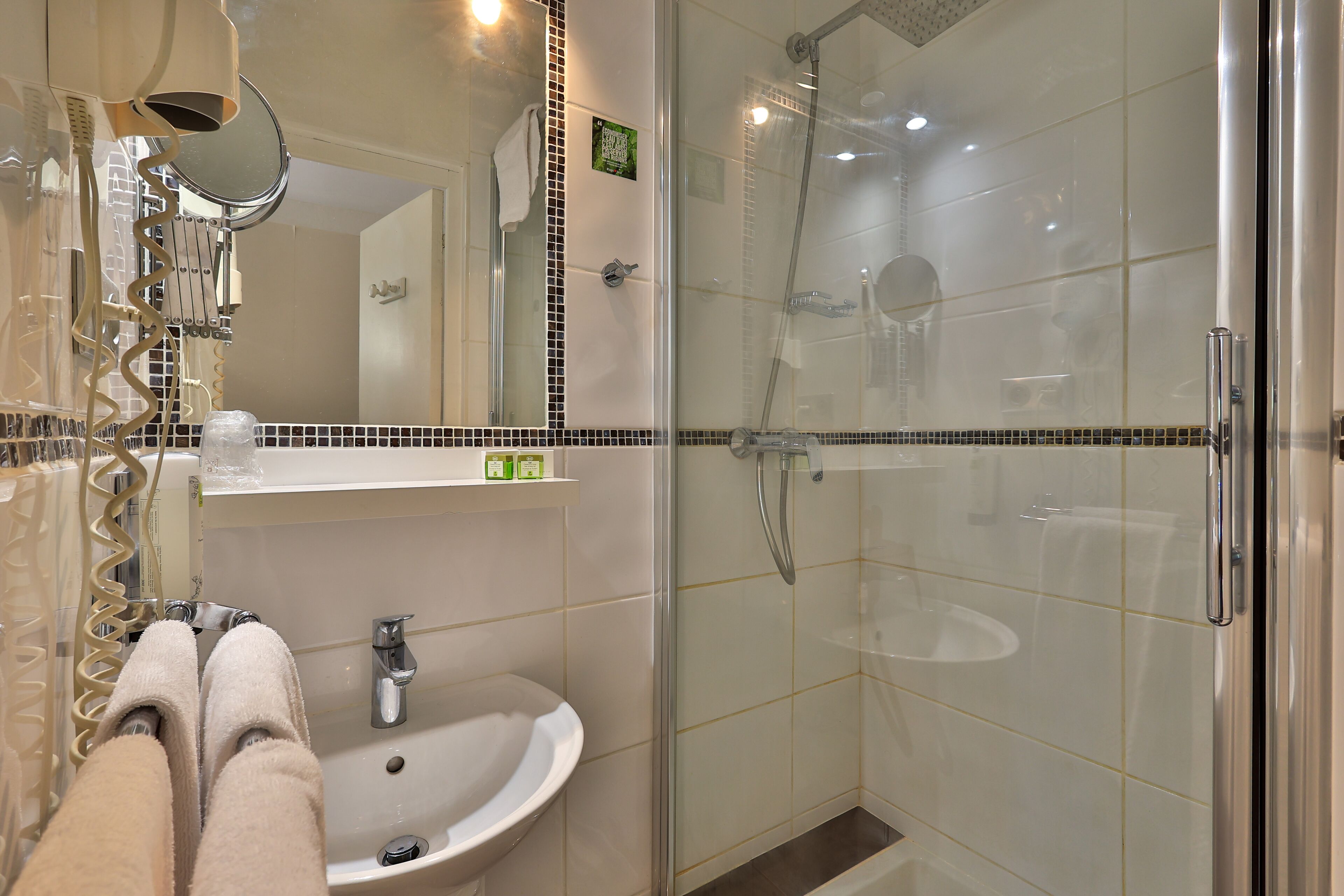 eco-friendly toiletries, hair dryer, towels, soap