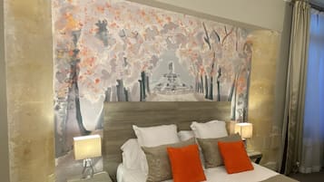 A hotel room with a bed, nightstands, a lamp, and a large abstract painting on the wall.