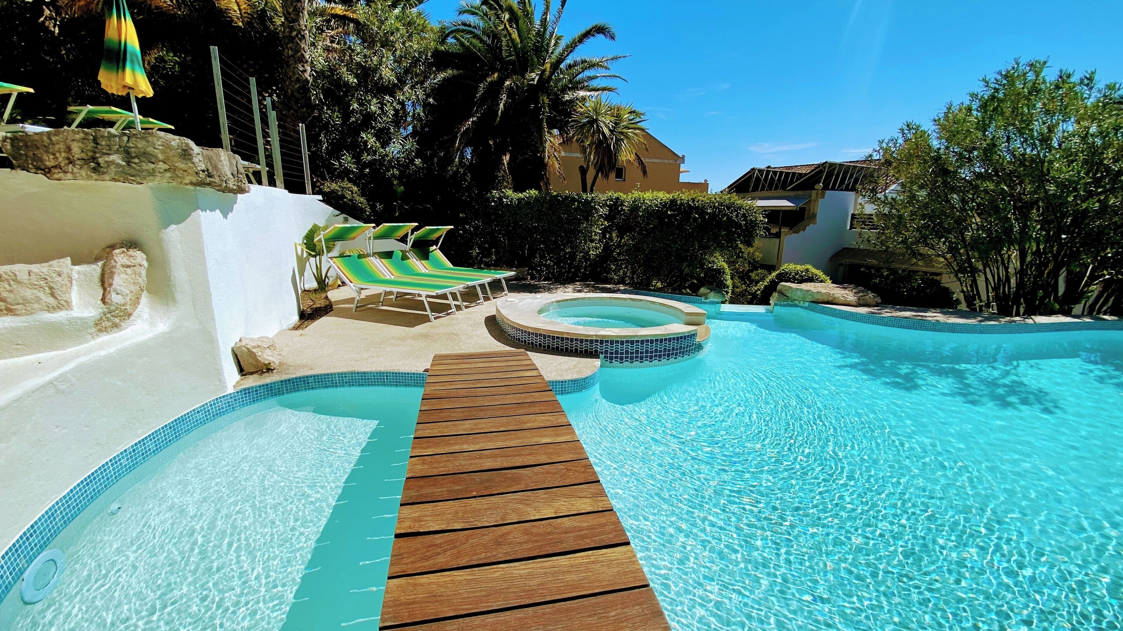 Seasonal outdoor pool, open 9:00 AM to 8:30 PM, pool umbrellas